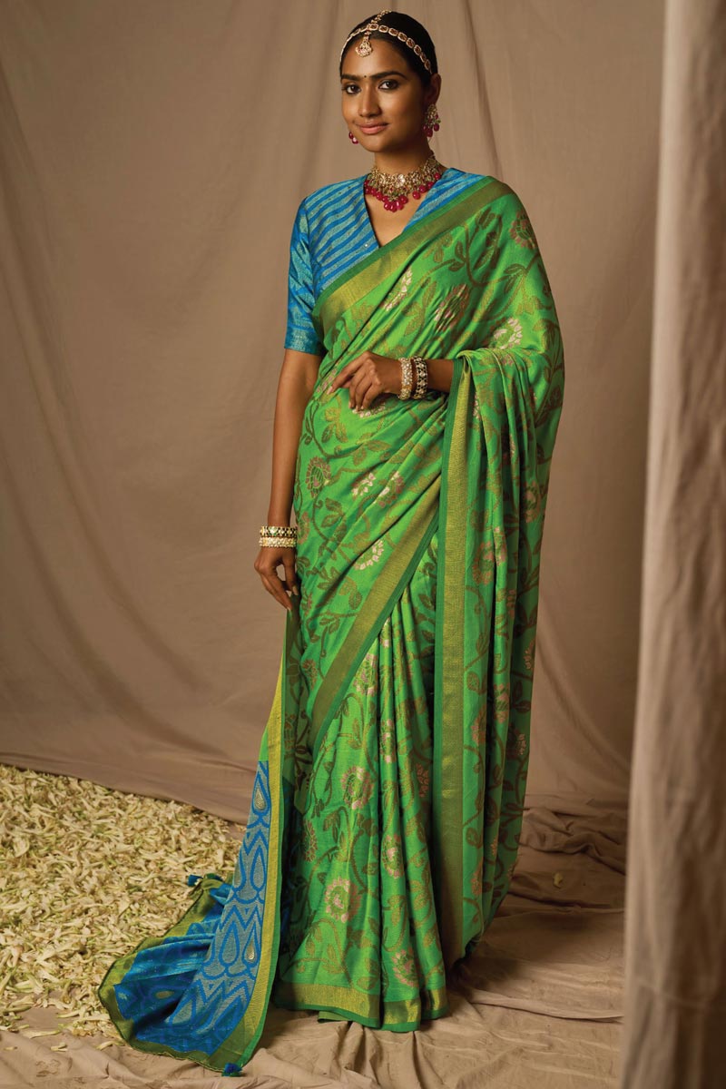 Amazing Weaving Work On Green Brasso Fabric Saree